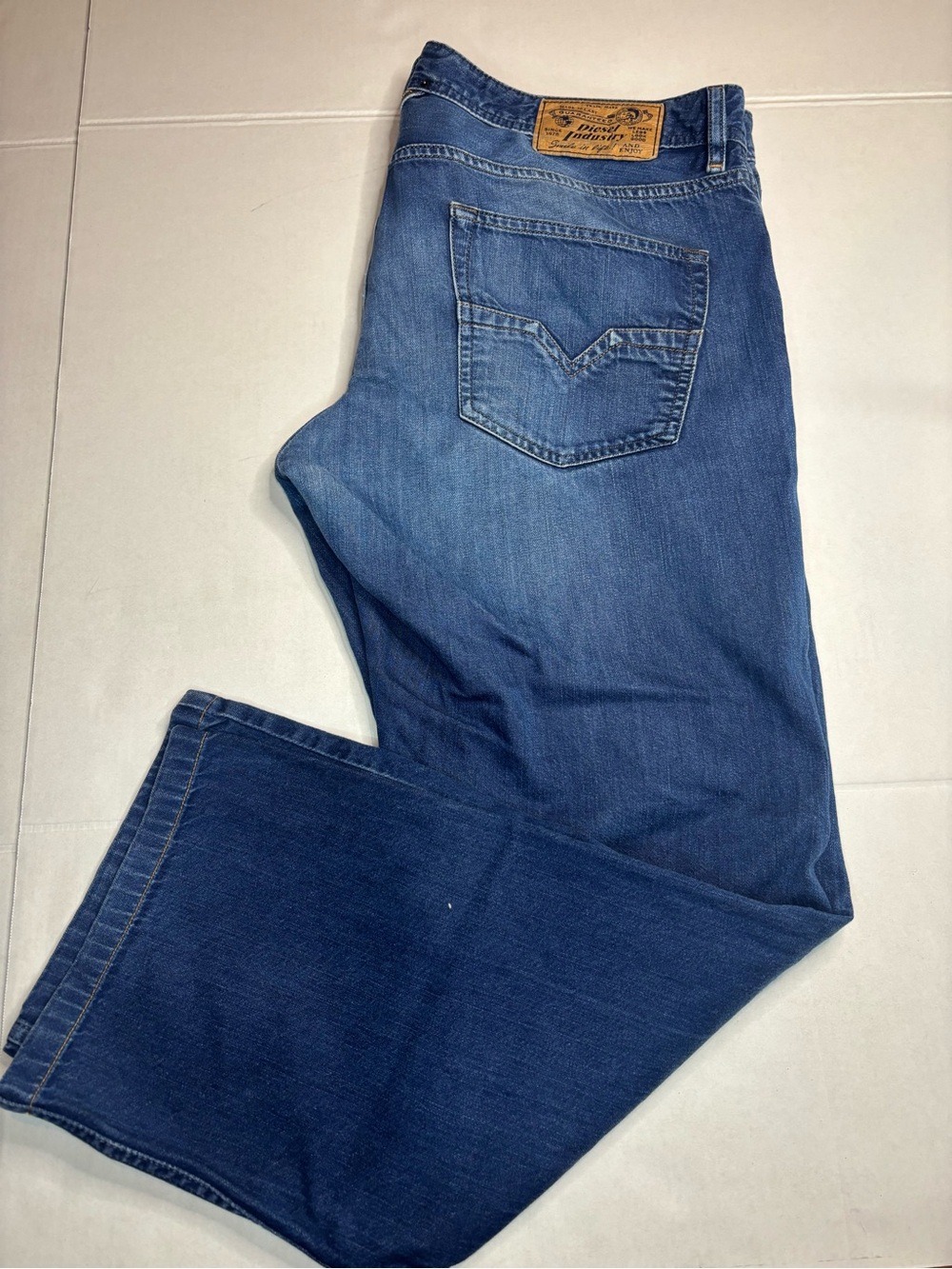 Diesel Larkee straight-fit jeans in a distressed blue wash 36x34